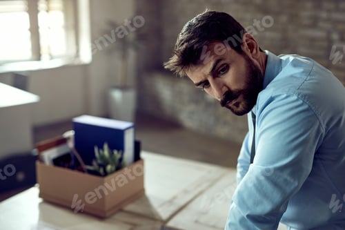Preview: Young businessman feeling disappointed after getting fired from his job.