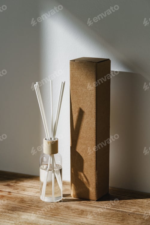 Preview: Elegant Reed Diffuser With Shadows on Wooden Surface in Soft Morning Light