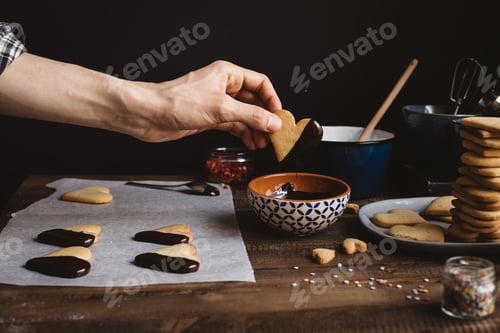 Preview: Heart Shaped Cookies Being Dipped in Chocolate