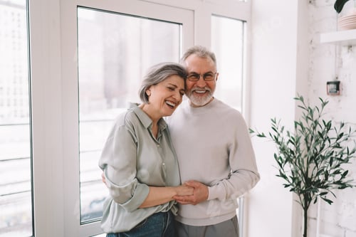 Preview: Happy Senior Couple Embracing and Smiling at Home