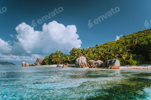 Preview: Anse Source d'Argent - Cloudscape over paradise beach with bizarre rocks and shallow lagoon
