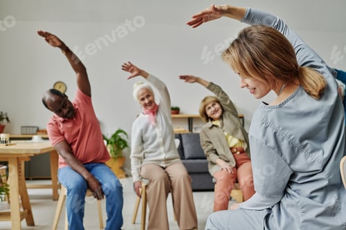 Preview: Young instructor doing exercises with people