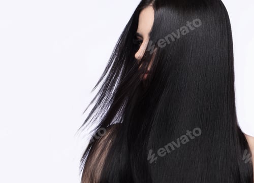 Preview: Beautiful brunette girl in move with a perfectly smooth hair, and classic make-up. Beauty face.