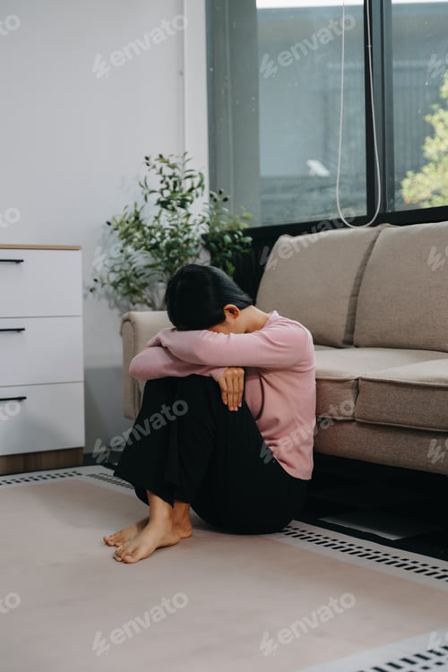 Preview: woman sit Depression Standing by window and anxiety Copy space.