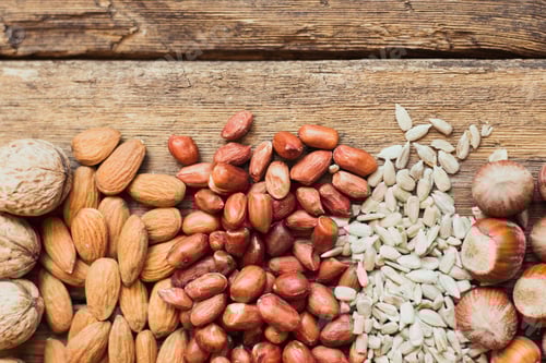 Preview: Assorted Nuts and Seeds on Wooden Background