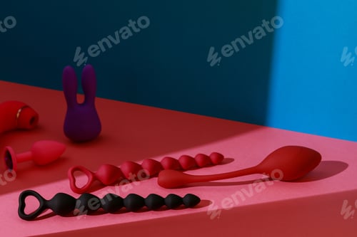 Preview: Different adult sex toys such as dildo, vibrator, buttplug on colored background. Sex shop concept