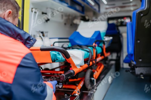 Preview: Close-up of empty stretcher inside ambulance vehicle.