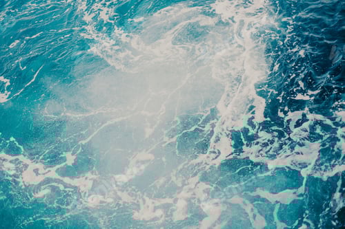 Preview: Ocean's embrace a dance of waves and foam.