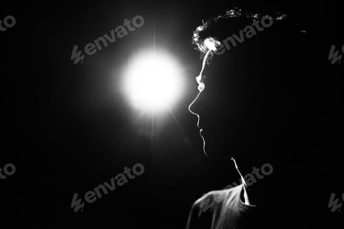 Preview: black and white silhouette portrait of a young guy on a black background