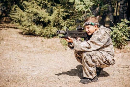 Preview: Children playing laser tag open air. Weapon in hands of people