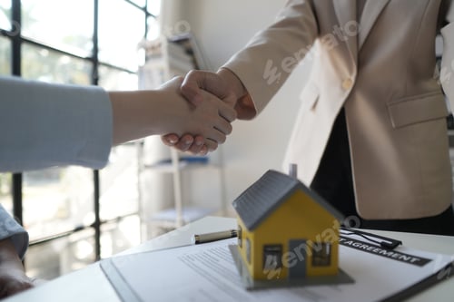 Preview: The bank's Mortgage Officers shake hands with customers to congratulate them after signing a housing