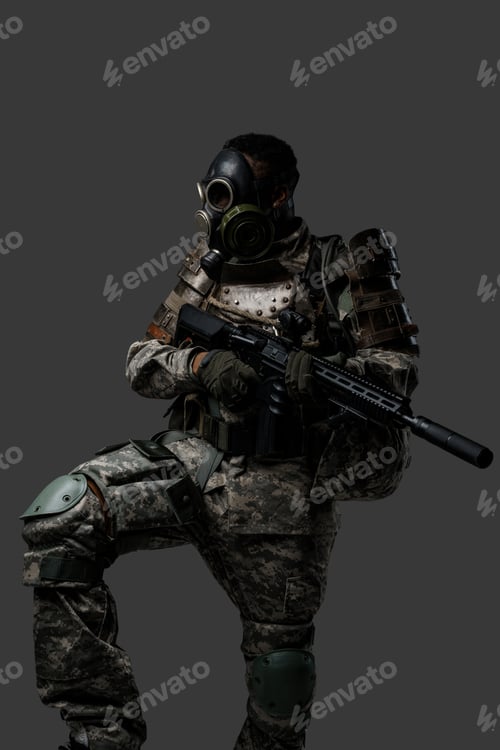 Preview: African military man dressed in uniform and gas mask