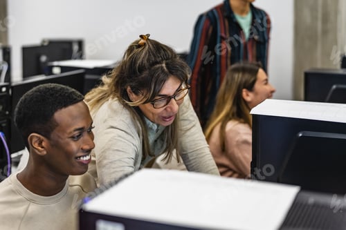 Preview: Young Afro American student with teacher during university lesson in classroom