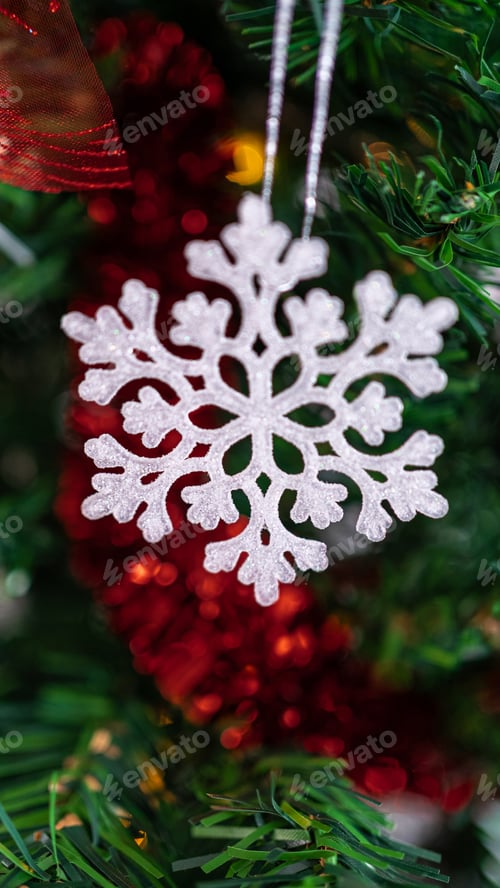 Preview: Adorned with holiday snowflake, a festive Christmas snow flake hang on the tree