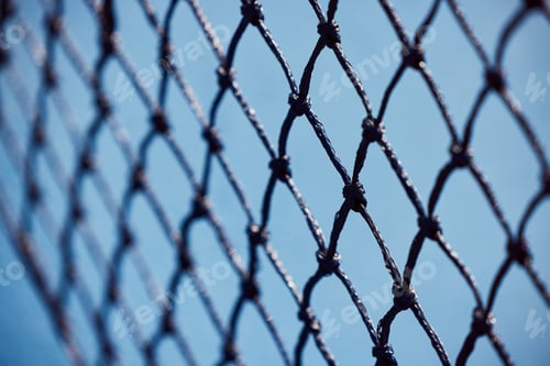 Preview: Sports is life. Shot of a tennis net on an empty court during the day.