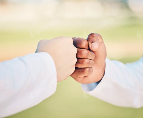 Preview: Sports, teamwork and hands for fist bump on field for motivation, support and solidarity outdoors.