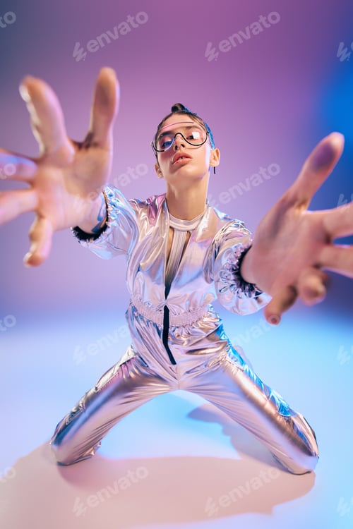 Preview: Capturing a stylish woman in holographic fashion striking a bold pose in a futuristic setting