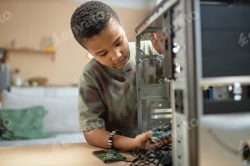 Preview: Black boy building computer