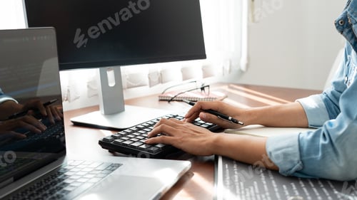 Preview: Software developer or programmer working data debugging improvement binary algorithm on desktop pc i