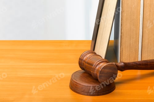Preview: Wooden gavel and books on wooden table
