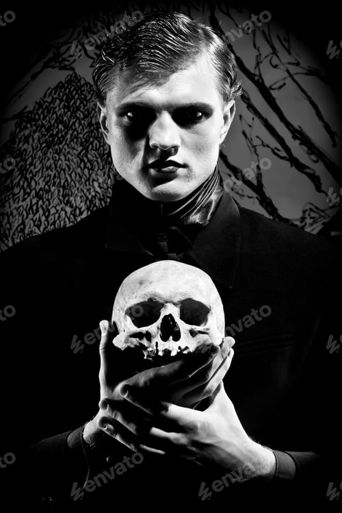 Preview: A young man dressed in black with a skull in his hands. Black and white. Artistic background created