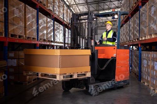 Preview: Industry warehouse worker in helmets with produce order details and checking goods supplies on boxes