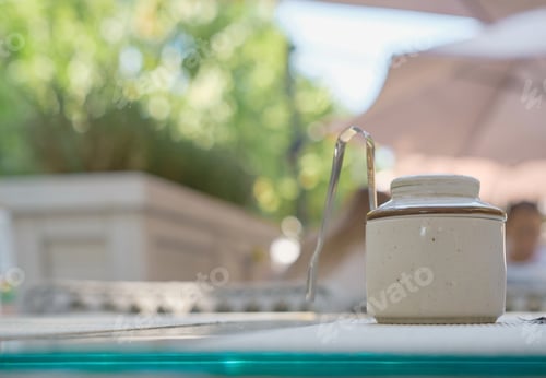 Preview: Blurred background, sugar bowl on a table in a cafe