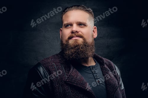 Preview: Portrait of bearded male on grey vignette background.