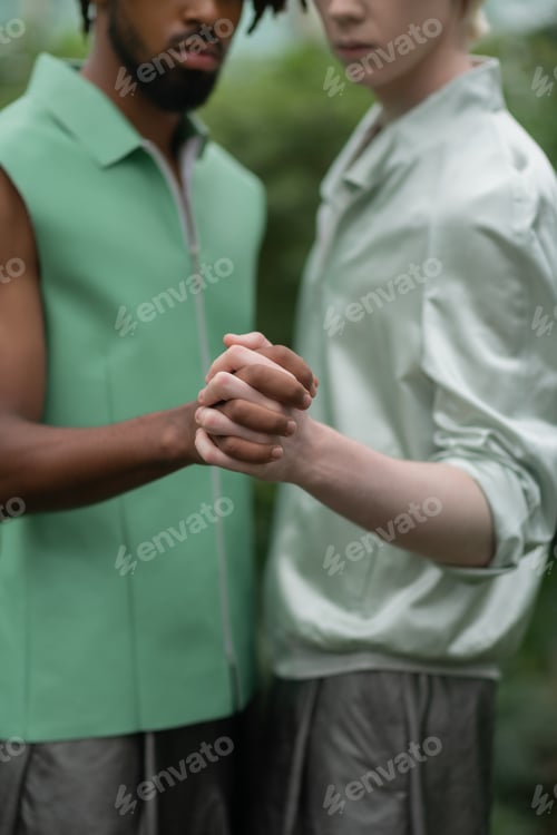 Preview: Two men participating in social campaign posing with hands