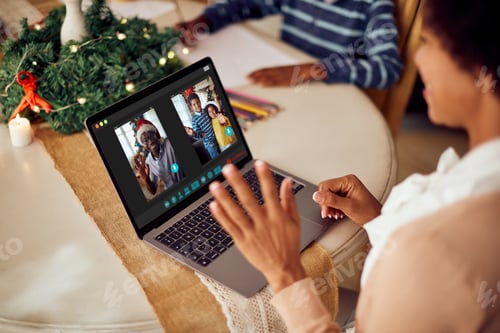 Preview: Happy African American family talking via video call on Christmas.