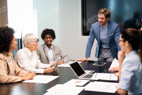 Preview: Group of business people working together, brainstorming in office