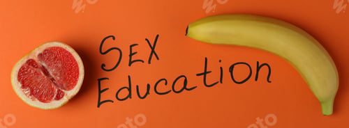 Preview: Sex education concept on orange background, top view