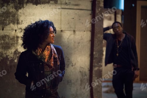Preview: Couple in dimly lit alley, Los Angeles, California, USA