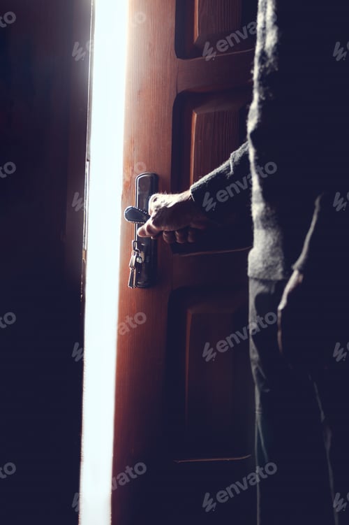 Preview: Silhouette of an elderly man opening the door
