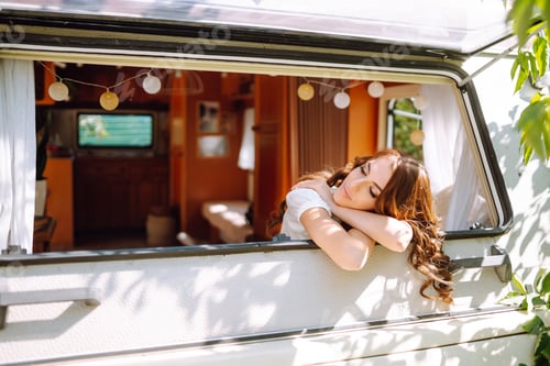 Preview: Beautiful stylish bride near trailer. Camping season. Marriage. Happy newlywed woman.