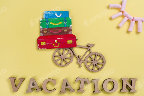 Preview: Background yellow, image of heap of suitcases on bicycle