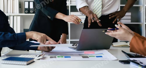 Preview: Two women and two men in a business meeting, Diverse business people laughing during a meeting,