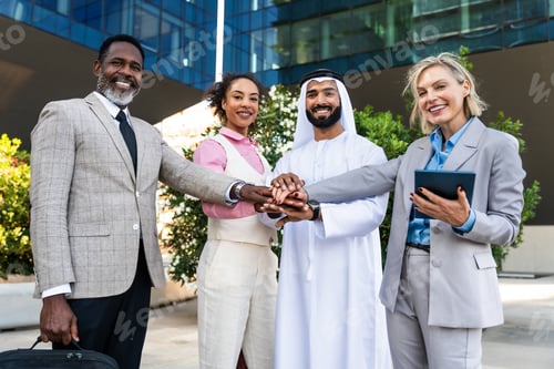 Preview: Group of multiethnic business people meeting an emirati businessman