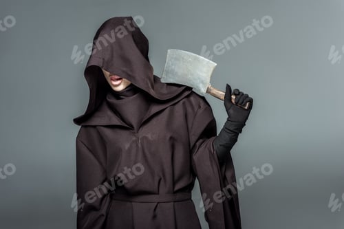 Preview: woman in death costume holding cleaver isolated on grey