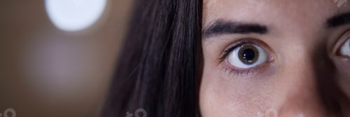 Preview: Eye, half and portrait of face of woman with focus, serious and looking intense isolated in blurred