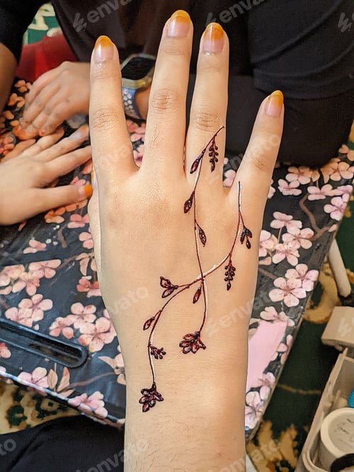 Preview: A hand with intricate henna designs, swirling patterns in reddish-brown, captivating work of art