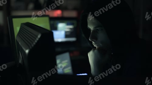 Preview: Young hacker connecting online with his computer