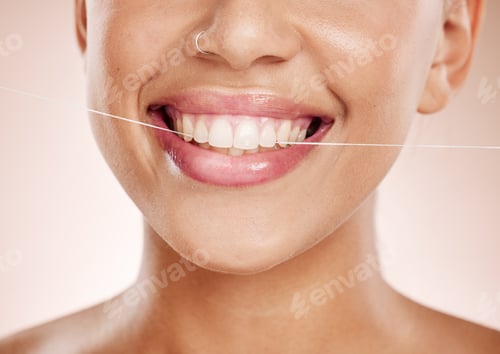 Preview: Floss, woman and smile with dental care, clean mouth and after brushing teeth against studio backgr