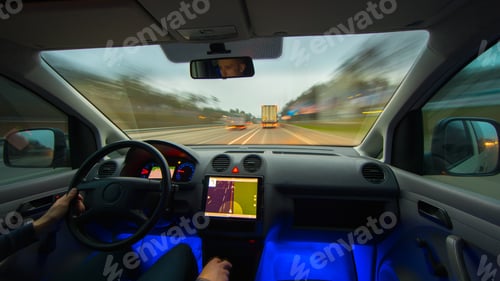 Preview: The man drive a vehicle on the highway. Inside view. Wide angle