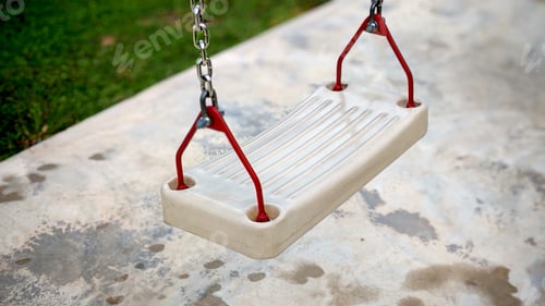 Preview: Close-Up View of Playground Swing Seat with White Plastic and Red Metal Brackets