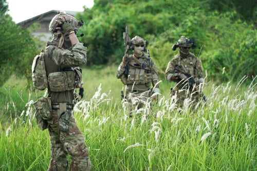 Preview: Soldier in full US MARSOC armed with assault rifle run through the abandoned building. Military