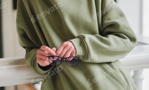 Preview: Glasses. Woman holding glasses