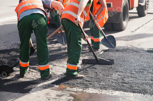 Preview: Workers on Asphalting paver machine during Road street repairing works. Street resurfacing. Fresh