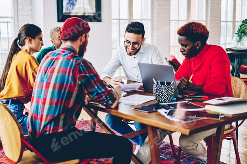 Preview: diverse hipster guys analyzing information while brainstorming in coworking