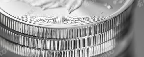 Preview: Closeup shot of Canadian Silver Maple Leaf bullion coins on a blurred background